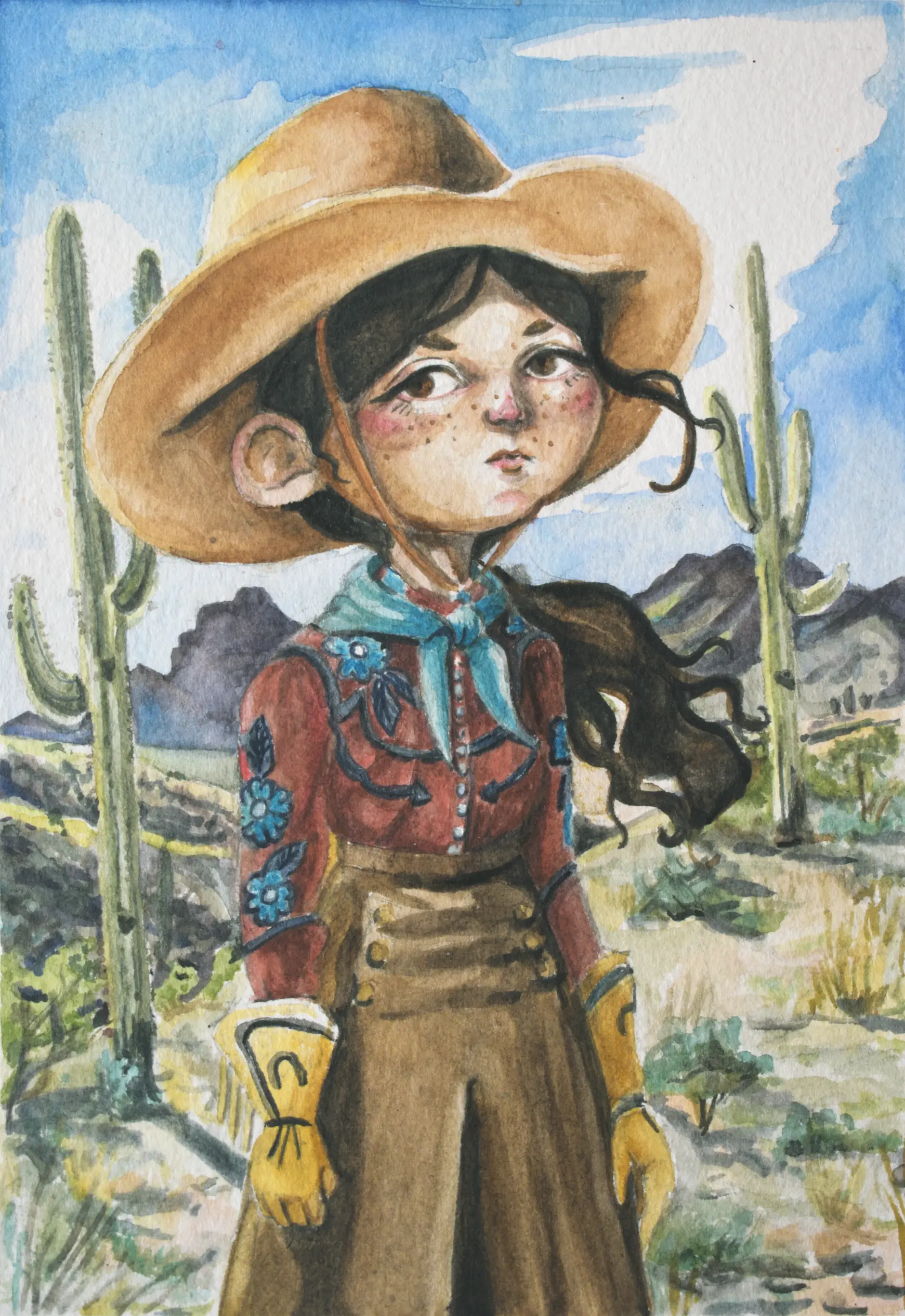 Cowgirl in front of desert background.